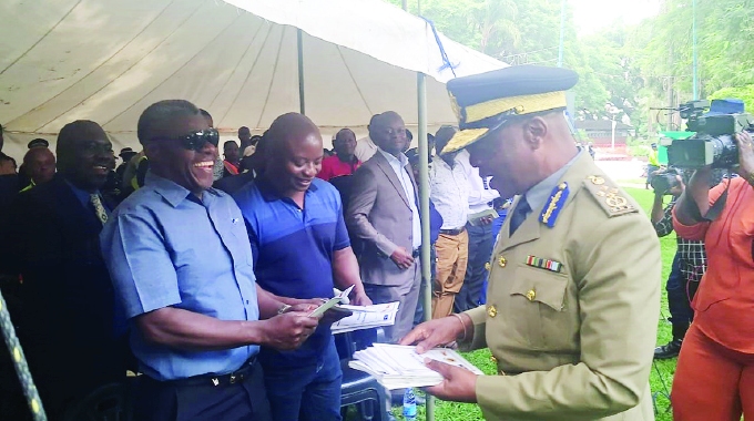 COPS TO USE BODY-WORN CAMERAS, TO CARRY NAME TAGS