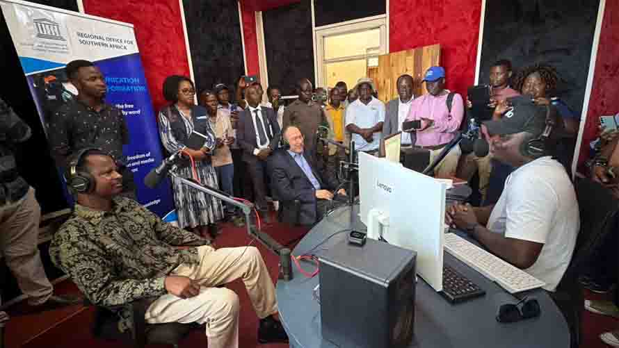 Deputy Information, Publicity and Broadcasting Services Minister, Honourable Omupilo Marupi (left), and UNESCO Assistant Director-General, Dr Tawfik Jelassi (right), go live on air during the commissioning of Tongogara FM Community Radio Station in Chipinge on Monday. – Picture: Tinai Nyadzayo