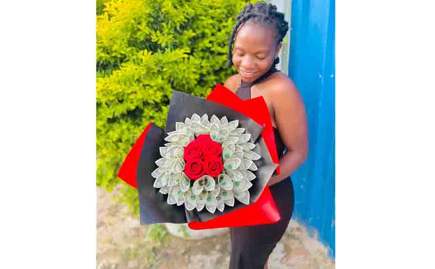 Miss Rachel Simango displays her money bouquet