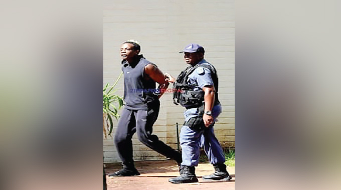 Chatunga Mugabe escorted in handcuffs after Gauteng shooting