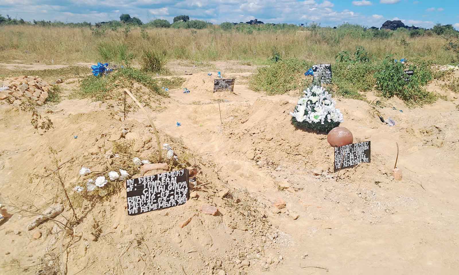 DRAMA AT BURIAL CEREMONY AS WOMAN TAKES OFF HER BLOUSE IN PROTEST