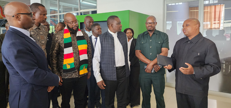 The Manica Post Editor, Cletus Mushanawani (right) explains the Zimpapers Mutare integrated newsroom operations to Information, Publicity and Broadcasting Services Minister Dr Zhemu Soda, (from right to left) Permanent Secretary, Mr Nick Mangwana, Minister Misheck Mugadza, Deputy Minister, Dr Omphile Marupi, Zimpapers Chief Executive Officer, Mr William Chikoto and other delegates
