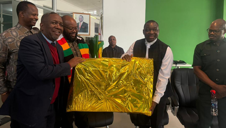 Information, Publicity and Broadcasting Services Minister, Dr Zhemu Soda (second from right) receives a gift from Zimpapers Broadcasting General Manager, Mr Comfort Mbofana, while from left Deputy Minister, Dr Omphile Marupi, Minister Misheck Mugadza, The Manica Post Editor, Cletus Mushanawani and Permanent Secretary, Mr Nick Mangwana look on during a tour of Zimpapers Mutare Unit yesterday (Thursday)