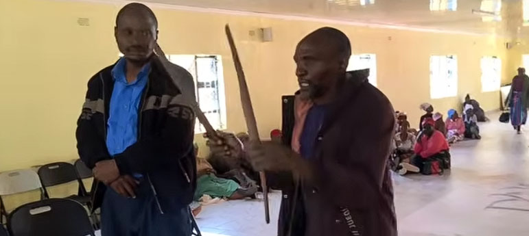 Maxmore Chimwaza with the cooking sticks which Caleb Karumbidza (left) used to assault him with