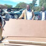 Ward 24 Councillor Tavengwa Zidya hands over doors to Manondwane Primary School in Nketa