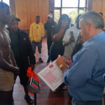 Zambian Ignatius Mutale, one of the pugilists to partake in the 17 bouts lined up for Pride of Mutare boxing tournament at Mutare Sports Club tomorrow (Saturday), undergoes the weight-in process under the watchful eye of WBF president Howard Goldberg at Mutare Hall today