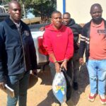 The convict, Tawanda Manzinde (34) flanked by detectives after he was apprehended