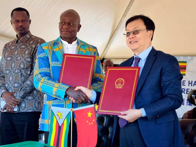 Ambassador Zhou hands over to Gvt China-Aid 300 Borehole Project