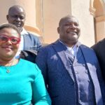 Mrs Evia Matura standing next to her husband and her lawyers
