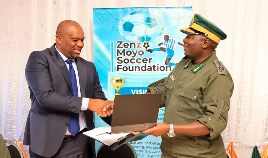 Zenzo Moyo (left) and Bulawayo Metropolitan Province Zimbabwe Prisons and Correctional Services Officer Commanding Mkhulunyelwa Ngwenya looks on