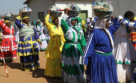 Elderly women from the Apostolic Ejuwel Jekenisheni Church carry food hampers donated by First Lady during the church's Passover Conference in Mabiya, Zimunya, Manicaland Province last Friday