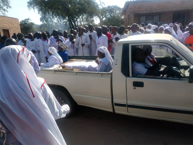 Mourners pay their last respects