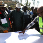 Special Advisor to the President on Monitoring the Impementation of Government Programmes and Projects, Hon. Dr Joram Gumbo (second from left), Manicaland Minister of State for Provincial Affairs and Devolution, Advocate Misheck Mugadza (left) and Ministry of Transport and Infrastructure Development, Chief Eng. Batsirai Chiwanga (right) discuss the planned construction of the Christmas Pass Bypass Road during a tour of the project site in Mutare, Manicaland Province on Wednesday. – Picture: Nyasha Chawatama