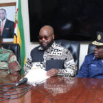Minister of State for Manicaland Provincial Affairs and Devolution, Advocate Misheck Mugadza (center) flanked by members of the JOC during a press statement