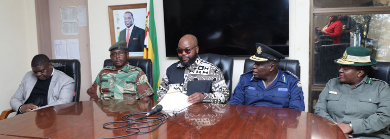 Minister of State for Manicaland Provincial Affairs and Devolution, Advocate Misheck Mugadza (center) flanked by members of the JOC during a press statement