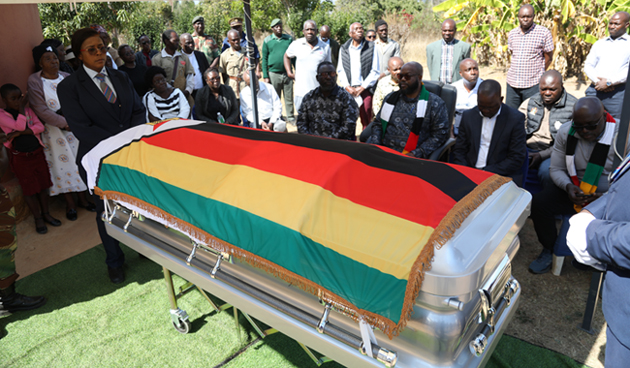Minister of State for Manicaland Provincial Affairs and Devolution, Advocate Misheck Mugadza (second from left), Senator Chief Mutasa (second from right), ZANU PF Manicaland provincial chairman, Cde Tawanda Mukodza (left) and other Government officials join members of the Ruwodo family in paying their last respect to the late national hero, Major General (Retired) Richard Ruwodo, at his rural home in Watsomba, Mutasa District last Sunday - Picture: Nyasha Chawatama