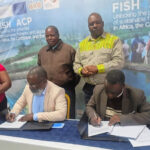 Mr Mwagura and Mr Kaitano sign the joint venture agreement