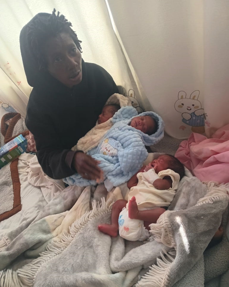 Ms Gwasira with her babies in hospital