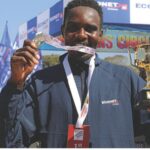 Men’s full 2026 marathon winner Tendai Zimuto holds up his medal and winner’s trophy after a brilliant performance at the 2026 Econet Victoria Falls Marathon, winning the 42-km race in a time of 2:16:10.