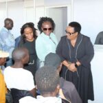 MEC Mathye (black dress) engaging the migrants being processsed at the Musina Camp