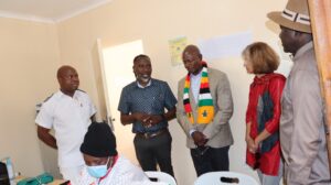 Beitbridge District Medical Officer Dr Lenos Samhere [blue shirt] updating Local Government and Public Works Minister Daniel Garwe [centre] and the UN Resident Coordinator Dr Rosemary Kalapurakal during the tour of a clinic at the Beitbridge Reception and Support Centre