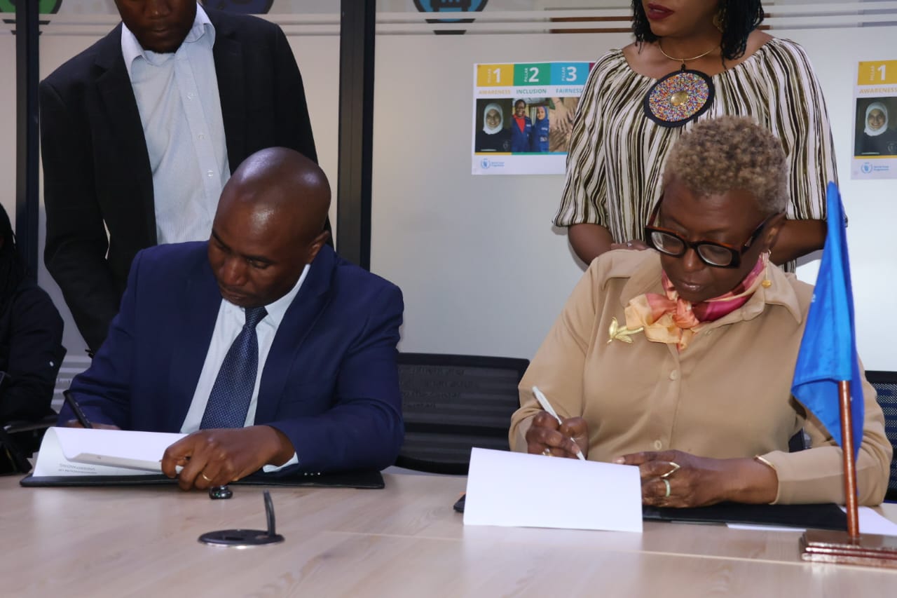 The United Nations World Food Programme (WFP) Zimbabwe Representative and Country Director, Ms Barbara Clemens (right), and Zimbabwe Mercantile Exchange (ZMX) chief executive officer Mr Collen Tapfumaneyi sign a Memorandum of Understanding in Harare on Wednesday to strengthen agricultural markets, improve market access for smallholder farmers, reduce post-harvest losses and build more resilient food systems.