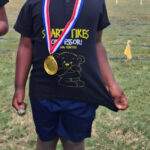 Aidan Mbofana after winning a medal for athletics at creche