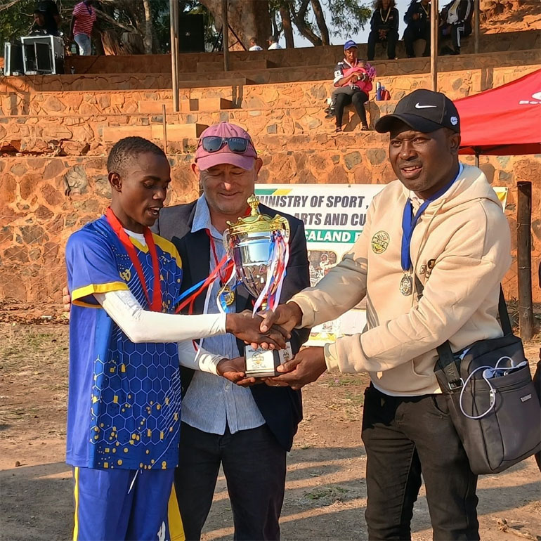 City Vendors skipper, Newton Nezomba, receives the winners’ trophy from Manicaland Provincial Recreation and Sports Development Committee chairperson, Peter Dumbropolous and MUSFA Gala Committee chairperson, Brian Chibwana last Sunday afternoon