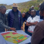 Sports, Recreation, Arts and Culture Minister, Lieutenant General (Rtd) Ambassador Anselem Nhamo Sanyatwe and Permanent Secretary in the Ministry, Mr Nicholas Moyo, being shown the map and intended land uses at Mount Worsley Estate near Mutare on Monday