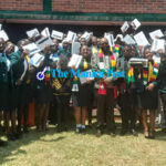 Minister of State for Manicaland Provincial Affairs and Devolution, Honourable Misheck Mugadza hands over Samsung tablets to Juniour Parliamentarians donated by President Mnangagwa and three robotic kits donated by TechTrek International at Mutare Boys’ High School today