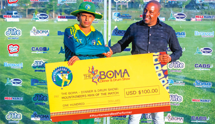 Ronak Patel being handed over an award by Mega Mountaineers general manager, Terry Nyakurimwa