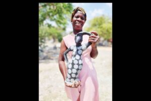 ARTIST USES STONE SCULPTURE TO  RAISE BREAST CANCER AWARENESS