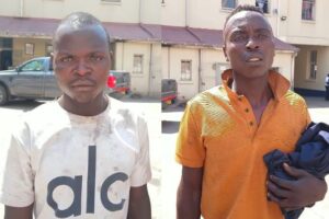 SHOT, CAGED, DOOMED! . . . Norwood shootout robbers remanded as dead accomplice haunts the dock