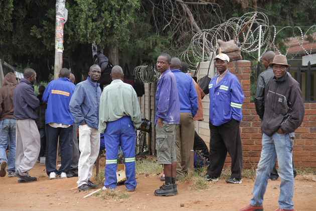 Job-seekers mill around the National Employment Service centre in Harare
