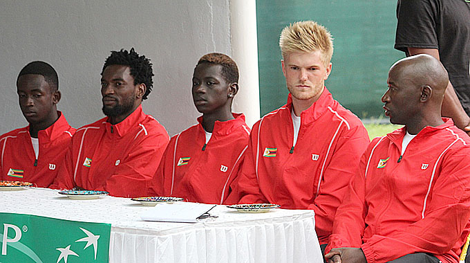 READY TO RUMBLE . . . The Zimbabwe Davis Cup team (from left) Mark Chigaazira, Takanyi Garanganga, Mehluli Sibanda, Benjamin Lock and captain Gwinyai Tongoona follow proceedings during yesterday’s draw at Harare Sports Club.