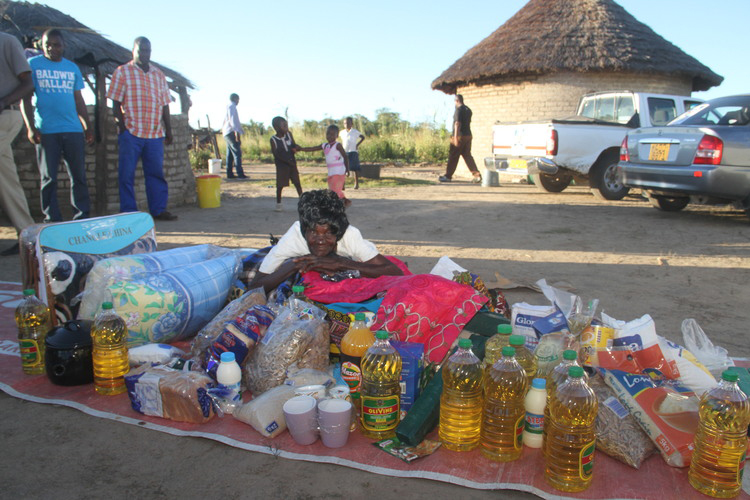 Mbuya Dembo with some of the donated goods