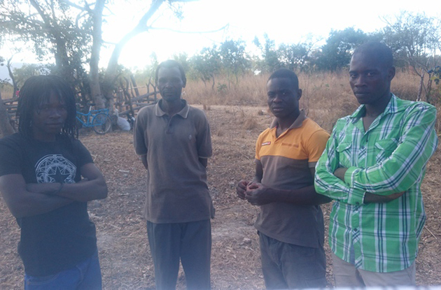 One of the tsikamutandas (left) pictured with villagers in Nyanga