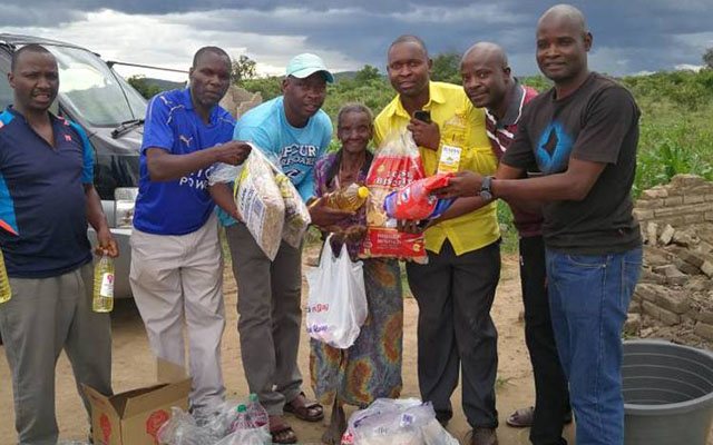 Mbuya Dembo receives groceries from Leonard Dembo’s fans