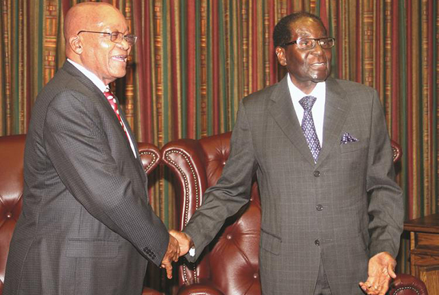 President Mugabe welcomes his South African counterpart President Jacob Zuma during the official opening of the Zimbabwe-South Africa Bi-National Commission in Harare yesterday. - Picture by John Manzongo