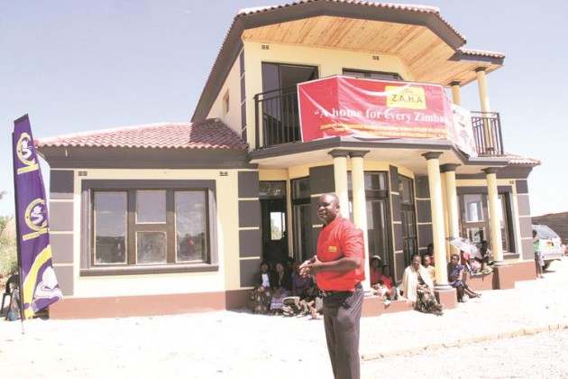 Zimbabwe Amalgamated Housing Association director Dr Killer Zivhu commissions a $25 000 model house at the launch of a cluster housing scheme in Chivhu at the weekend, a project that is set to benefit low-income earners. - (Picture by Memory Mangombe)