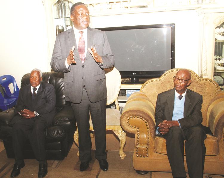 Vice President Emmerson Mnangagwa, flanked by Defence Minister Dr Sydney Sekeramayi(left) and Mr Paul Chidyausiku (right) addresses mourners at the funeral of Retired Chief Justice Godfrey Chidyausiku at the family home in Highlands, Harare, yesterday. — (Picture by Kudakwashe Hunda)