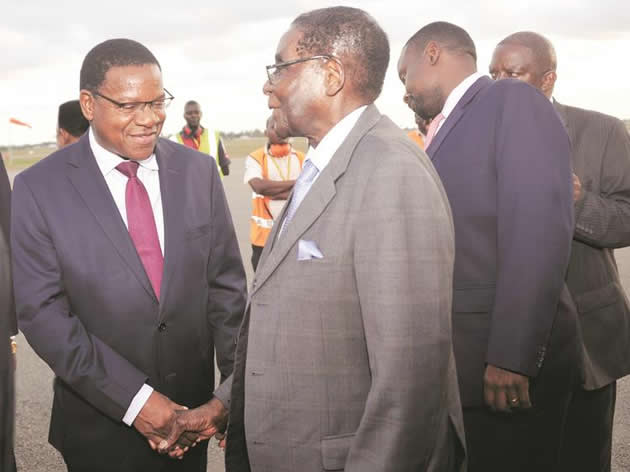 President Mugabe is welcomed by Tanzanian Minister of Foreign Affairs and International Co-operation Mr Bernard Membe at Julius Nyerere International Airport yesterday. He is in Dar es Salaam for the inauguration of Tanzania’s newly-elected President John Magufuli. — (Picture by Presidential Photographer Joseph Nyadzayo)