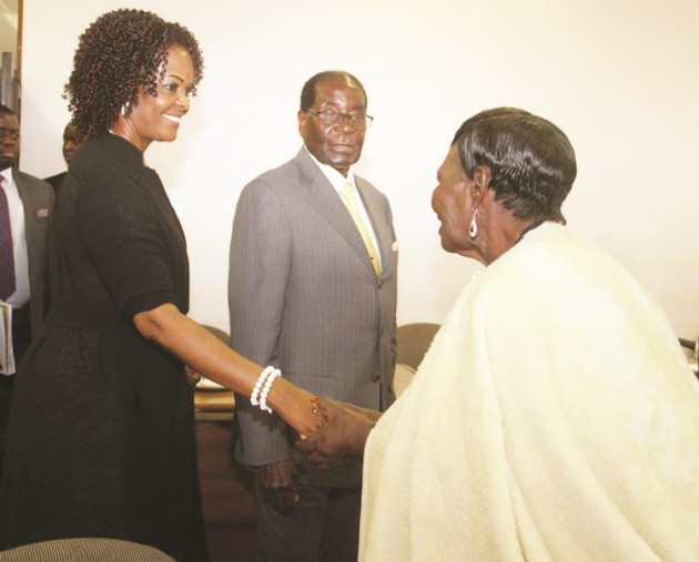 President Mugabe looks on as zanu-pf secretary for Women’s Affairs First Lady Amai Grace Mugabe shakes hands with Minister of State for Masvingo Provincial Affairs Senator Shuvai Mahofa before a Politburo meeting in Harare yesterday. — (Picture by Kudakwashe Hunda)