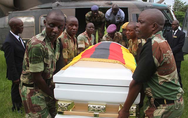 Pallbearers carry a casket bearing the body of national hero Cde Peter Chanetsa  at One Commando Barracks yesterday on arrival from Chinhoyi, Mashonaland West Province. — (Picture by Kudakwashe Hunda)
