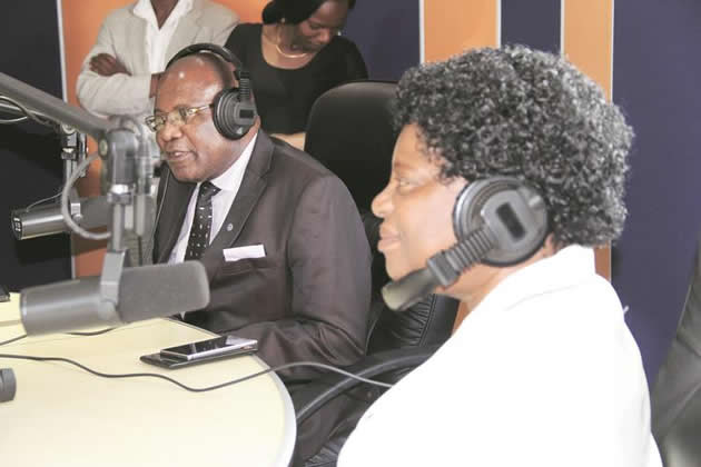 Minister Mushohwe (right) and Deputy MInister Mathuthu get a feel of being on air at Star FM studios