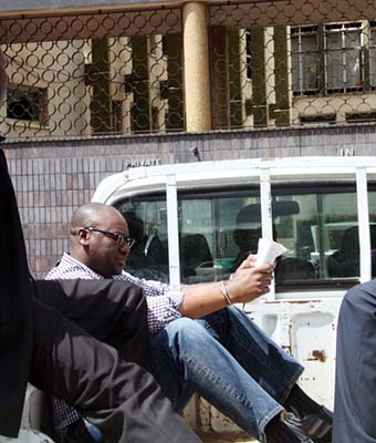 Evan Mawarire arrives at the Harare Magistrates’ Courts in the company of police detectives recently. — (Picture by Shelton Muchena)