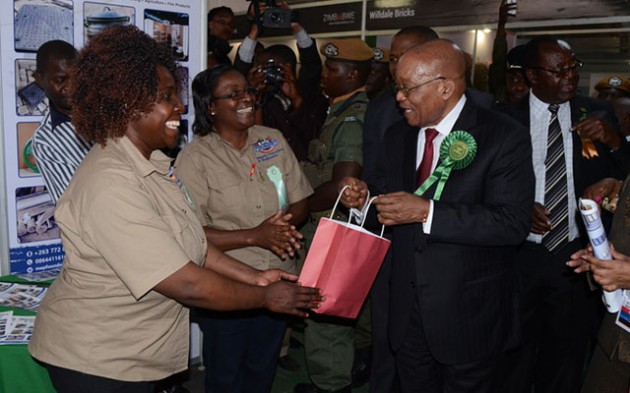 South African President Jacob Zuma receives a gift from Meprin Founders officials at their stand at the Zambian Agriculture and Commercial Show in Lusaka on Saturday. Meprin was one of the Zimbabwean companies exhibiting at the show which was opened by President Zuma.
