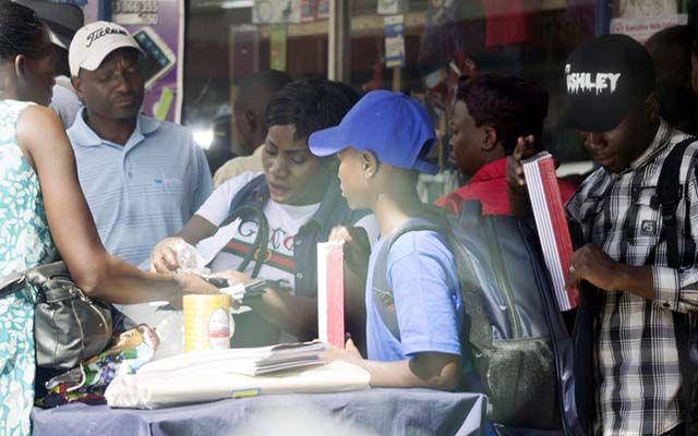 Students buy stationery ahead of schools opening next week. Most people to buy on the street rather than stationery shops.-(Picture by Nicholas Bakili)