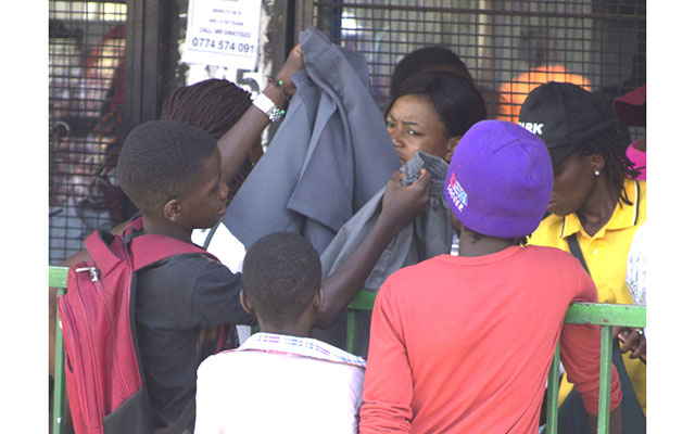 Students buy stationery ahead of schools opening next week. Most people to buy on the street rather than stationery shops.-(Picture by Nicholas Bakili)