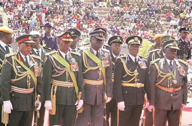 Zimbabwe Defence Forces General Constantino Guvheya Nyikadzino Chiwenga, Zimbabwe National Army Commander Lieutenant-General Philip Valerio Sibanda, Air Force of Zimbabwe Commander Air Marshall Perrance Shiri, Police Deputy Commissioner-General Levy Sibanda and Commissioner-General of Zimbabwe Prisons and Correctional Services, Retired Major General Paradzai Zimondi follow proceedings during Heroes Day commemorations at the National Heroes Acre in Harare yesterday